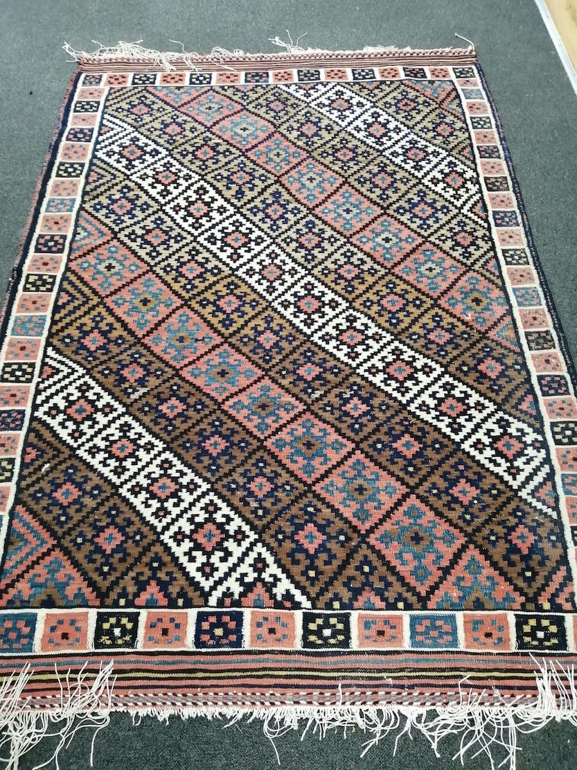 A polychrome Kelim flatweave rug, 196 x 130cm